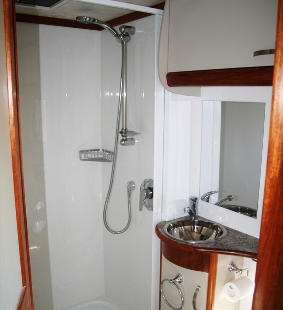 Large shower with modern hand basin